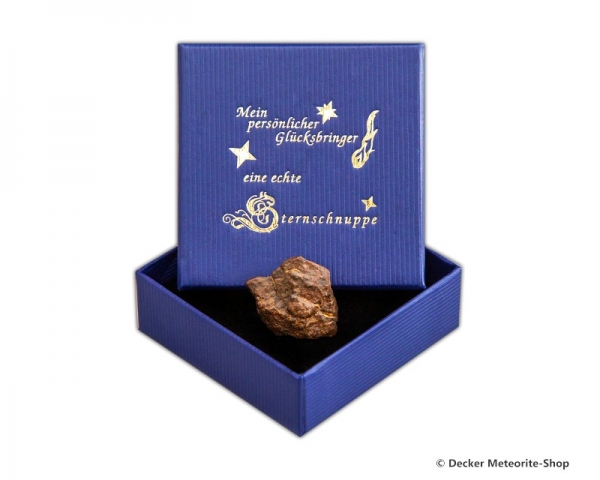 Glücksbringer-Sternschnuppe als Steinmeteorit in blauer Glücksbringer-Geschenkbox